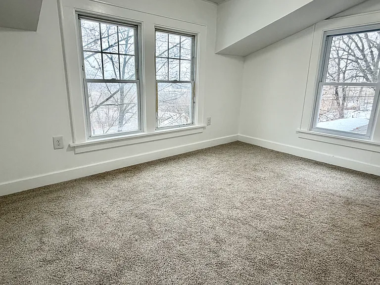Primary Bedroom has windows all around!