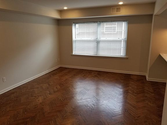 Herringbone hardwood floors in the living room