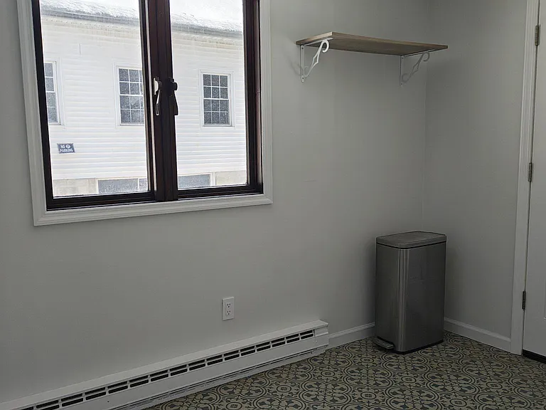 Laundry room is spacious and leads to screen porch