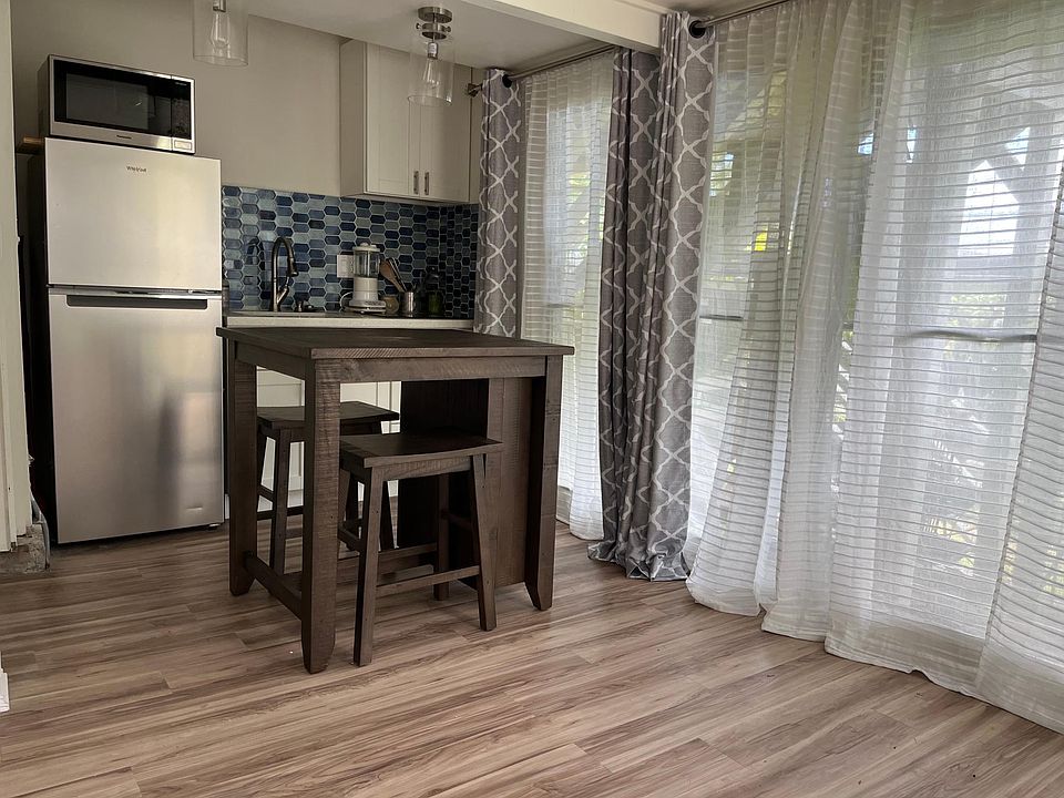 Newly renovated kitchen, quartz counter, new stainless steel refrigerator.