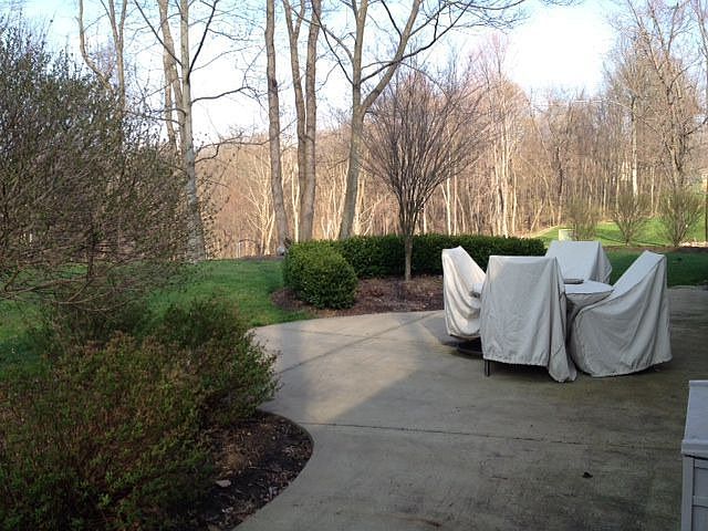 Get ready to entertain in style this summer! Concrete patio spans back of home