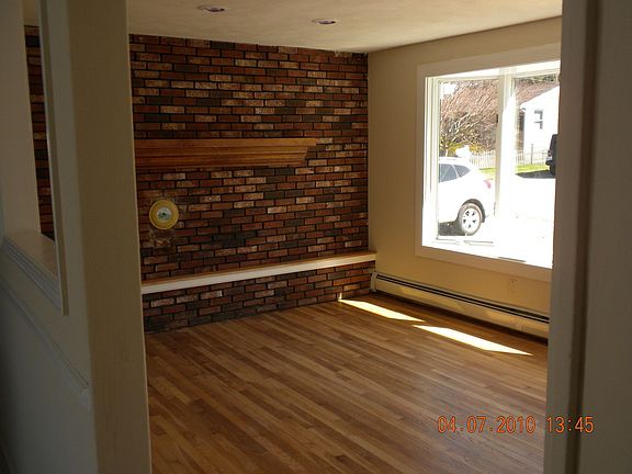 living room w hardwds & bay vwindow