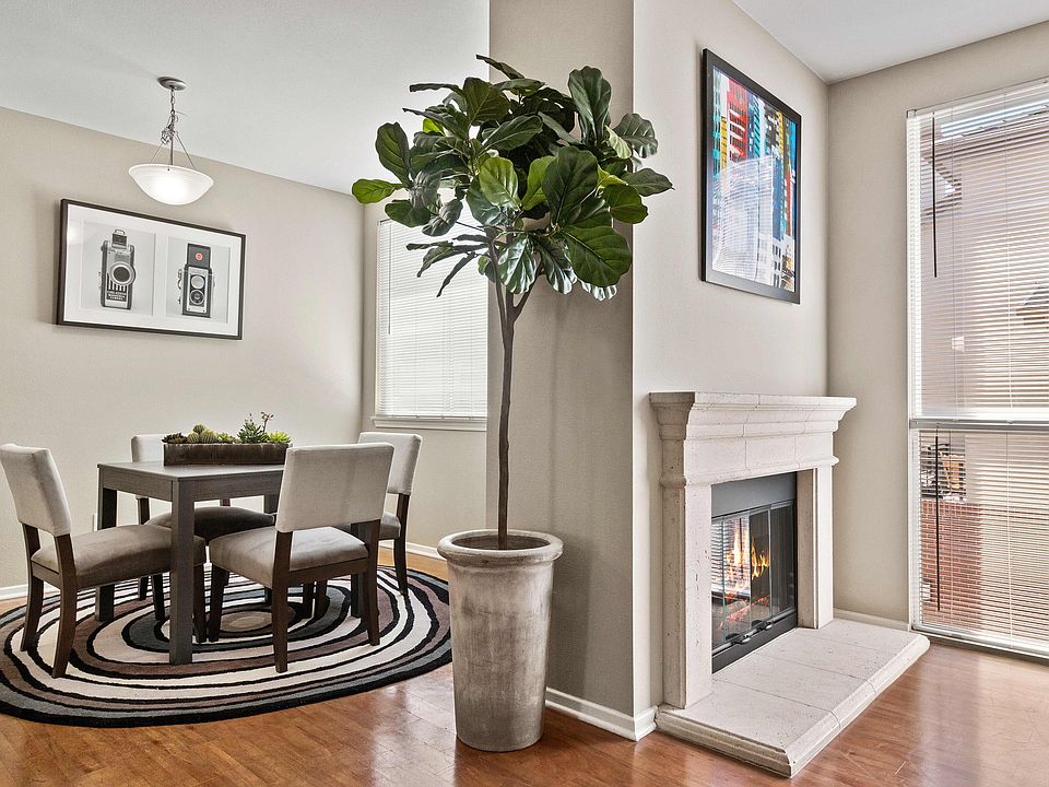 Beautiful dining area with elegant fireplace.