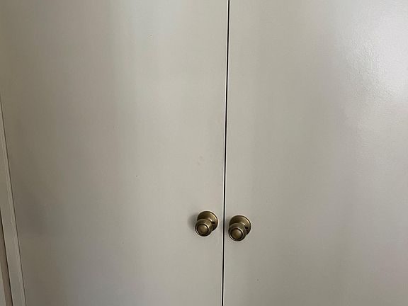 Laundry closet down stairs between kitchen and 1/2 bathroom