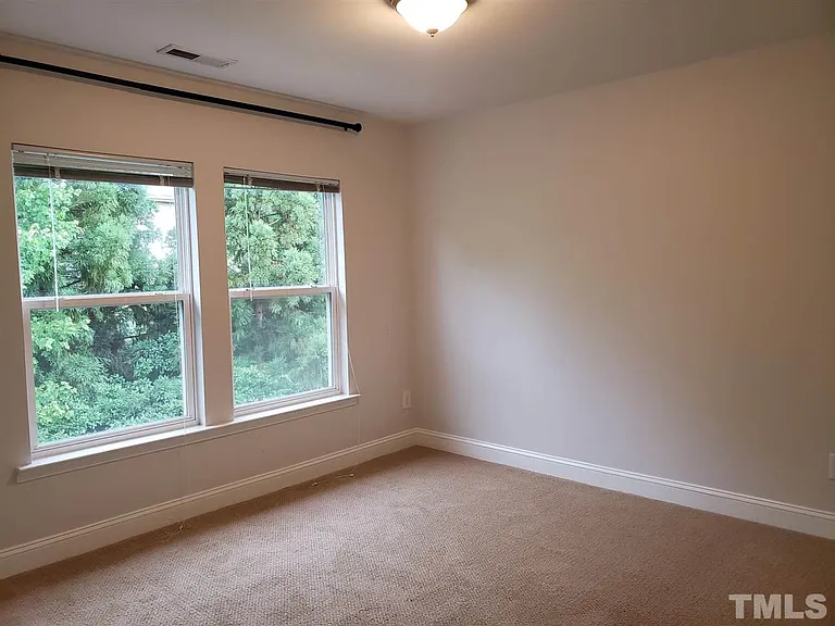 Second bedroom with private backyard view