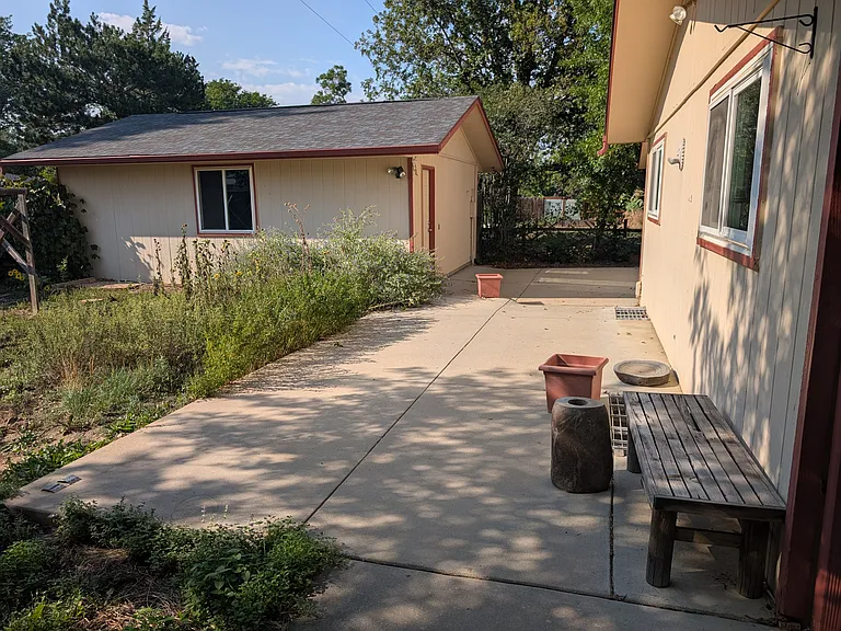 back yard with picture of detached 2 car garage