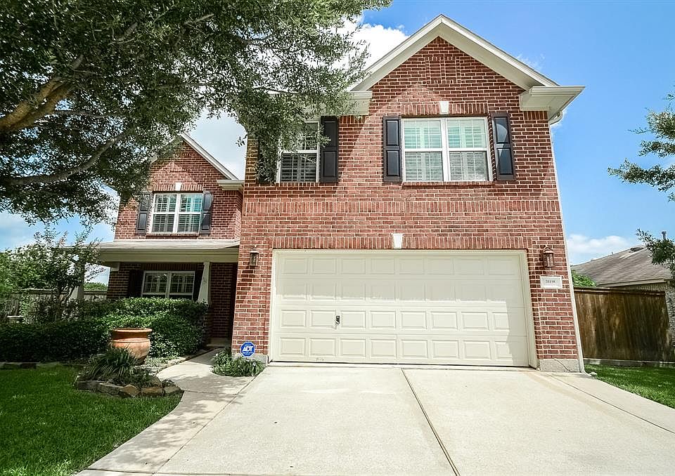 If you're looking for a home that stands out from the rest, you've found it! Begin your journey through the home with a beautiful entrance surrounded by an impressive landscape.