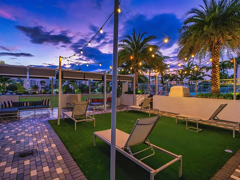 Relaxing Patio with Lounge Chairs and Sunset Sky at South of Atlantic