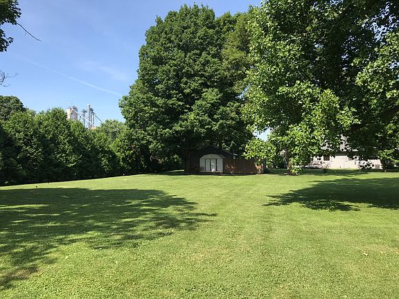 Near center of lot facing W