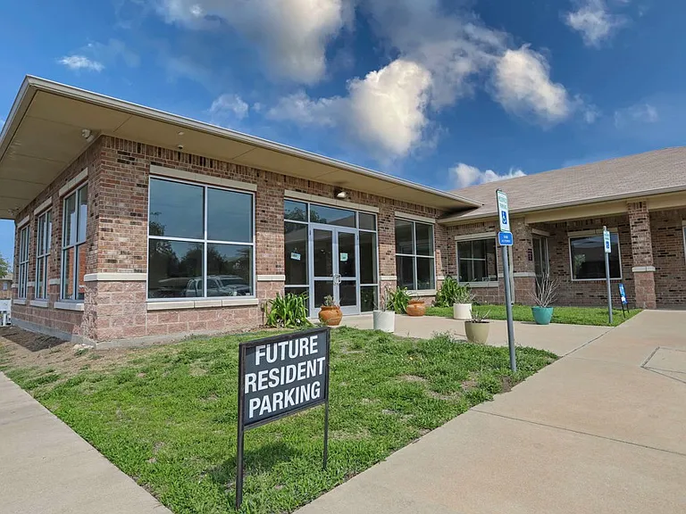 Modern leasing office and resident lounge featuring welcoming curb appeal.