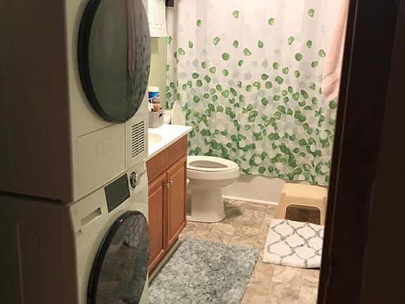Bathroom with stackable full size washer and dryer
