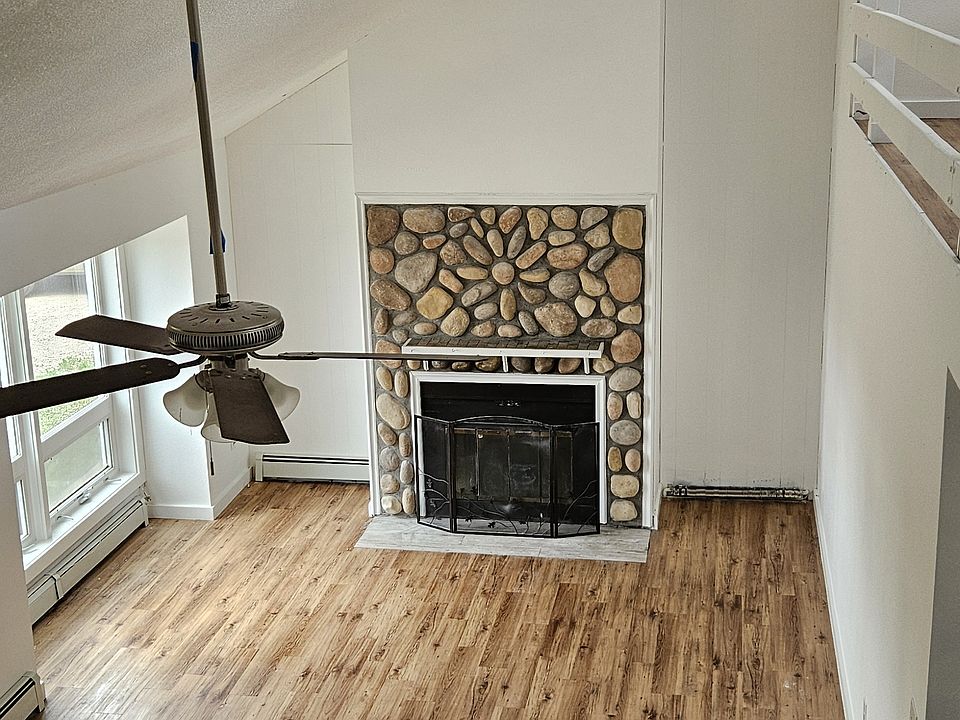 Living room and fireplace from stairway