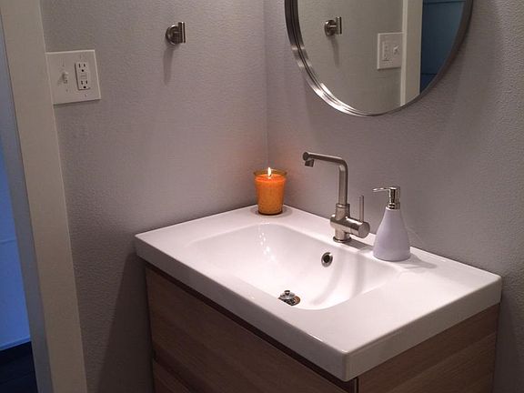 bathroom from the shower/tub looking toward the sink & doorw
