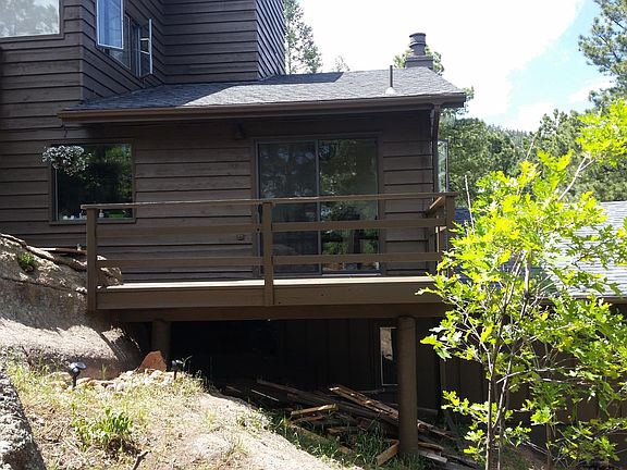 Back of home with nice deck off kitchen