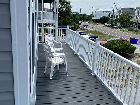 FRONT PORCH OVERLOOKING N. NEW RIVER DRIVE AND BIKE TRAIL ALONG ROAD