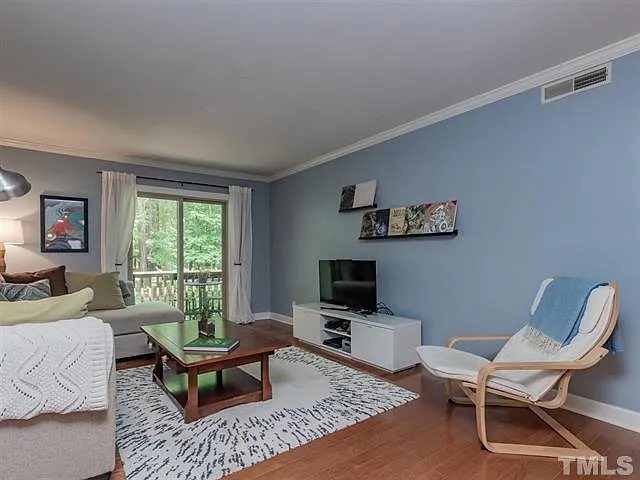 Hardwood floors in living room - view of Pritchard Park from deck.* - 1513 E Franklin St