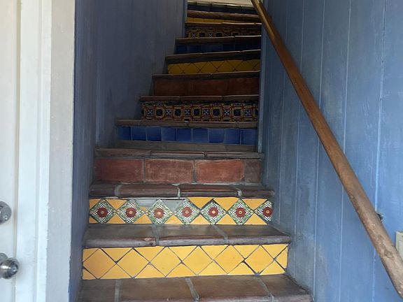 stairs to white front door