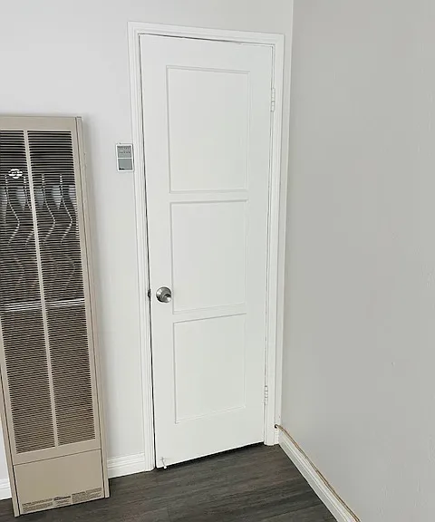 Coat Closet next to heater in Living Room