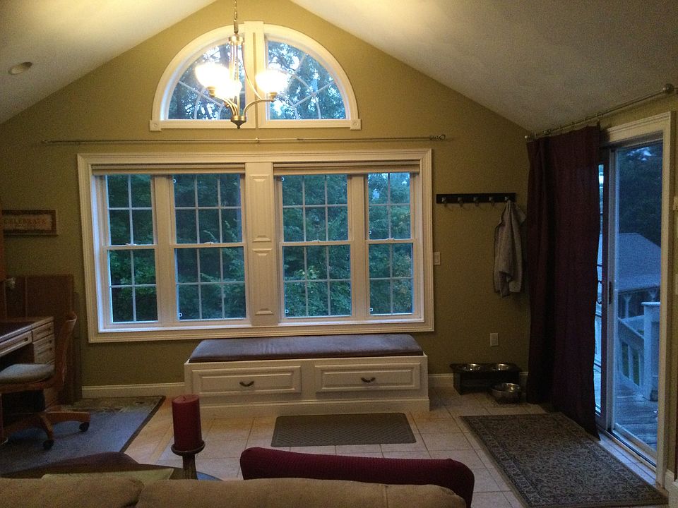 Of south facing windows in family room, window seat and sliders to the right