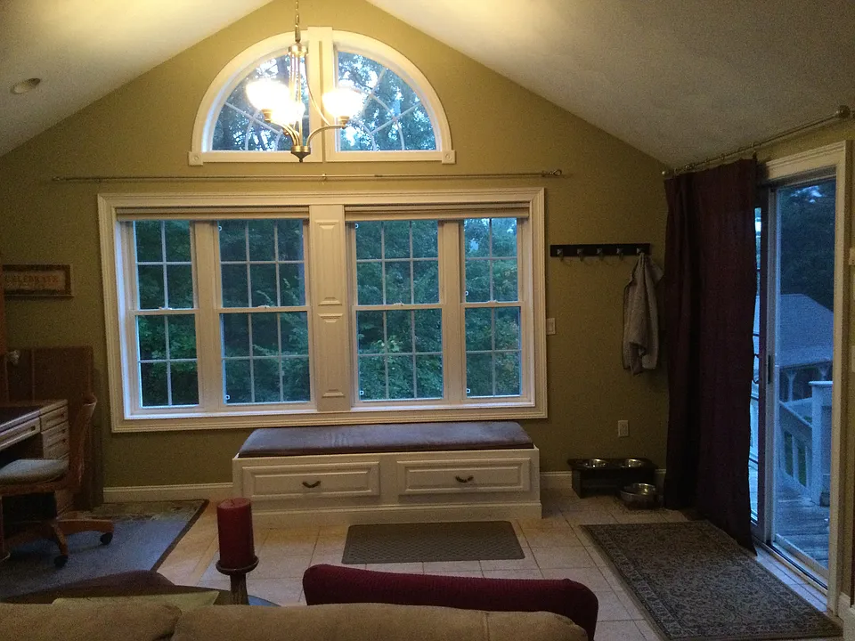 Of south facing windows in family room, window seat and sliders to the right