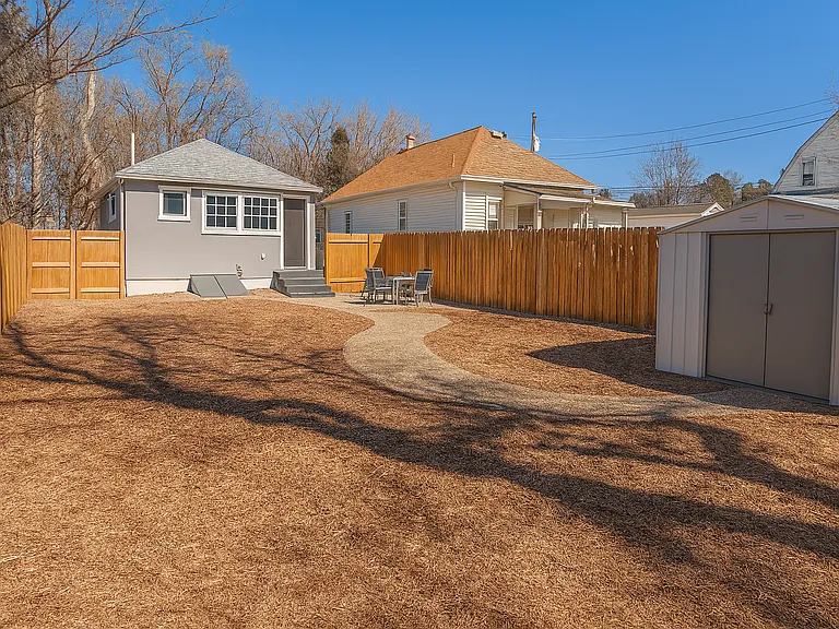 Spacious, fenced backyard_perfect for kids, pets, or soaking up the sun.