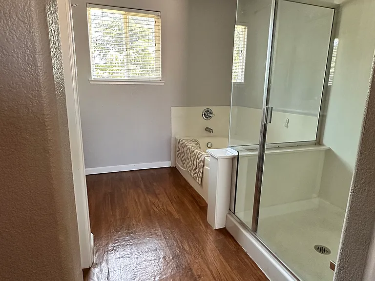 Large bathroom connected to large bedroom