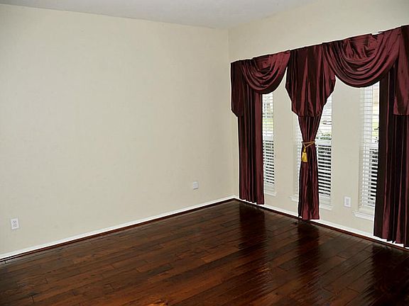 Formal Living Room or Study With Custom Draperies & Wood Floors