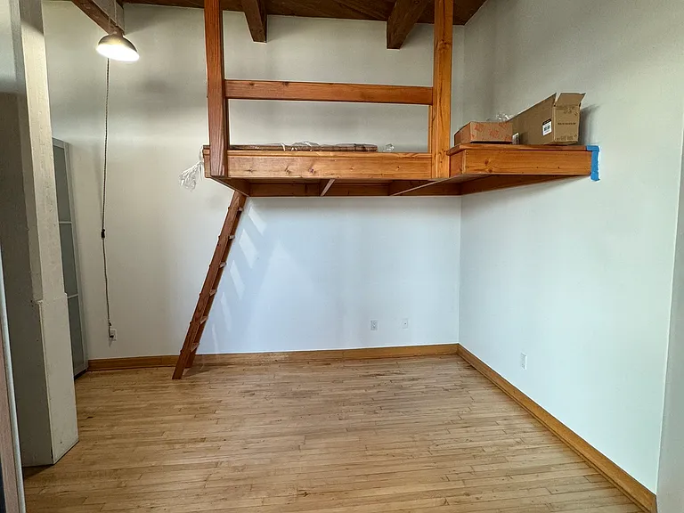 Bedroom with loft that can fit queen size mattress. Queen size bed and night stands can fit below loft