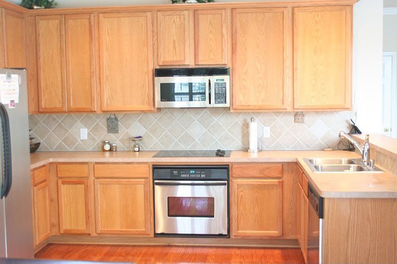 Stainless Steel Appliances, Hardwood Floors and Tile Backsplash