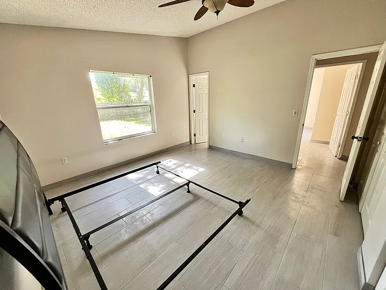Master bedroom with private bath and window