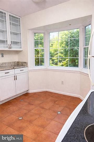 Eat-in kitchen with tile floors, granite countertops