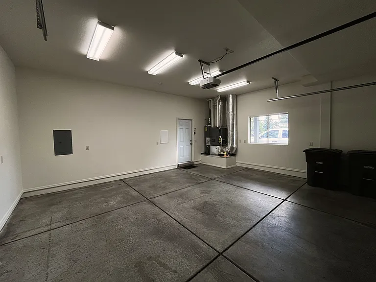 large 2 car garage with extra storage space (inside)