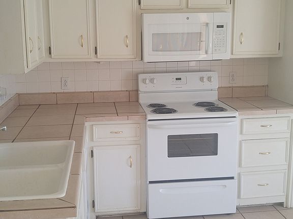 Kitchen with range microwave