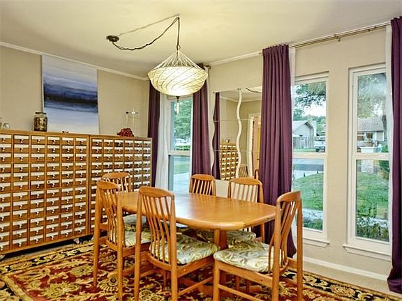 A light-filled dining room overlooks the front yard.