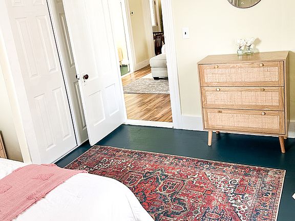 Bedroom 1 with dresser and closet space