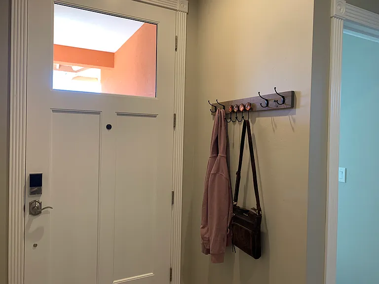 Entranceway with custom built coat hanger.