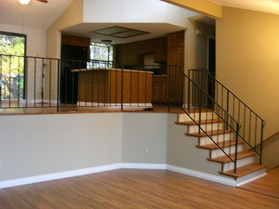 LIVING LOOKING UP TO KITCHEN