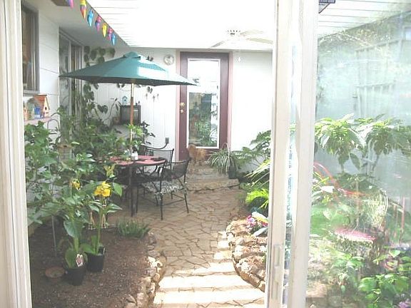 Enclosed patio looking from BBQ area to inside towards house.