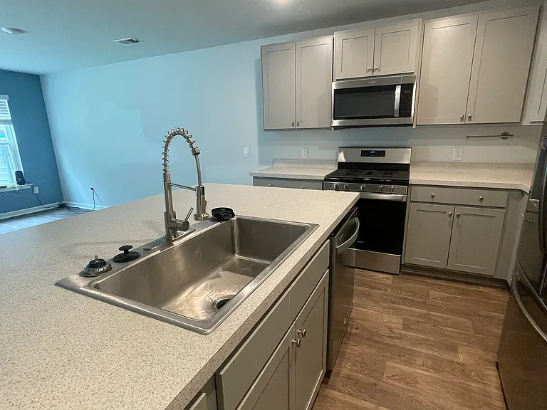 Kitchen - gas stove and updated sink with glass rinser attachement