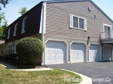 Rear of building - Garage. : One car garage with storage space as well.