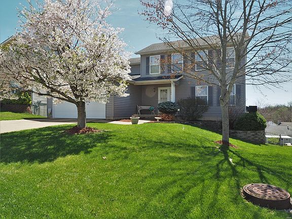 Welcome to 1026 Crabapple Drive! Beautifully manicured and lancscaped lawn with a few budding trees.