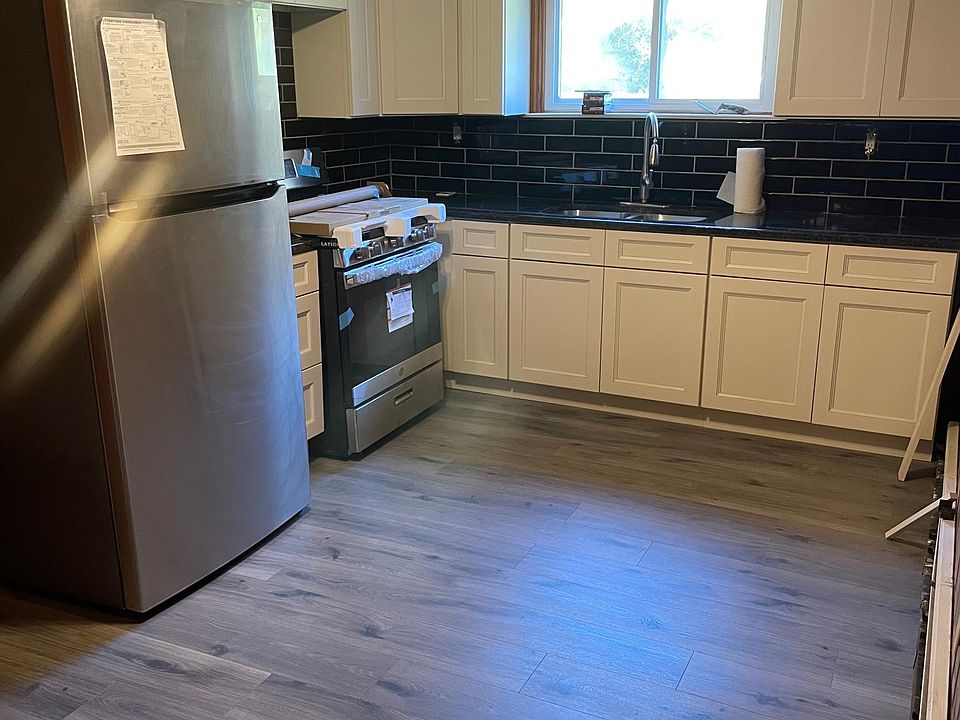 NEW KITCHEN CABINETS , FRIDGE , RANGE GRANITE COUNTER