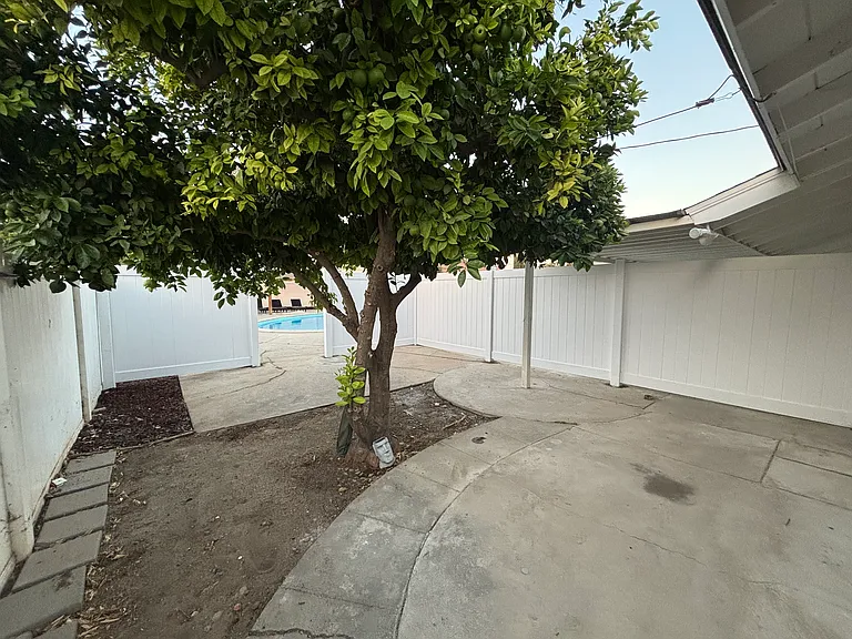 Backyard and door to community pool