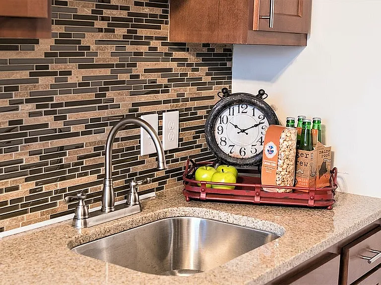Experience elegance in this thoughtfully designed kitchen corner featuring modern amenities and charming decor.