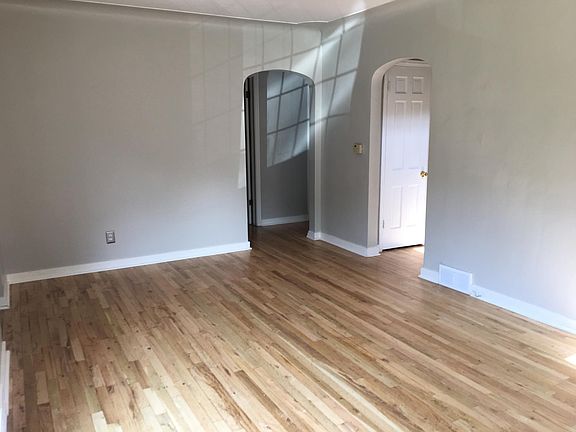 Arched doorways and recently refinished hardwoods