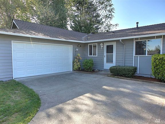 This home has sweet curb appeal with dogwood trees, a long curved driveway, freshly painted exterior, new garage doors and roof. You'll also appreciate that the windows have been updated to vinyl double panes. The garage offers space for workshop and storage.