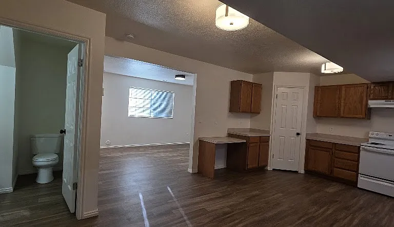 Kitchen, Living Room, and Half Bathroom