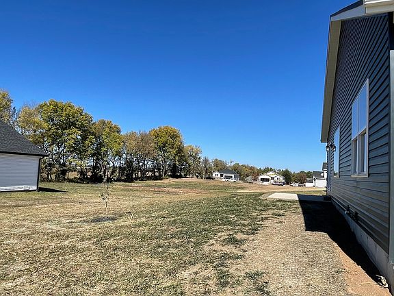 View of backyard toward open common area