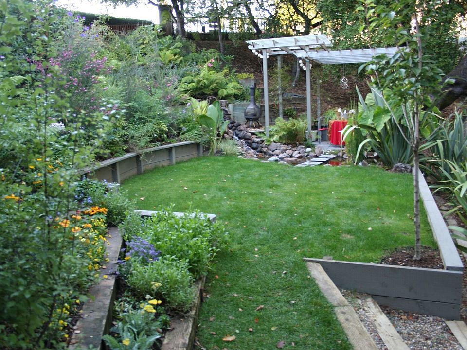 flat lawn area with pergola