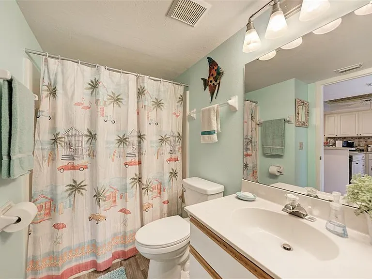 Direct access for ultimate comfort. _ No need to walk through the hall_the guest bath connects directly to the guest bedroom. Clean, bright, and featuring a full tub/shower, it's the perfect setup for a stress-free stay in Unit 1003.